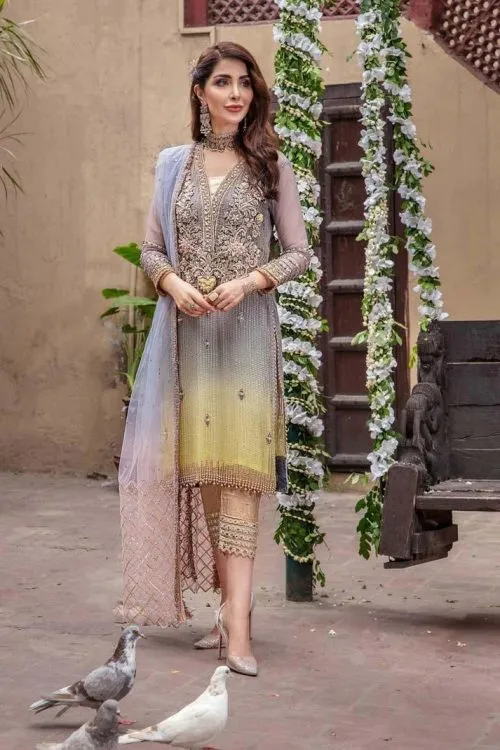 Pastel embellished formal suit with delicate embroidery and elegant dupatta